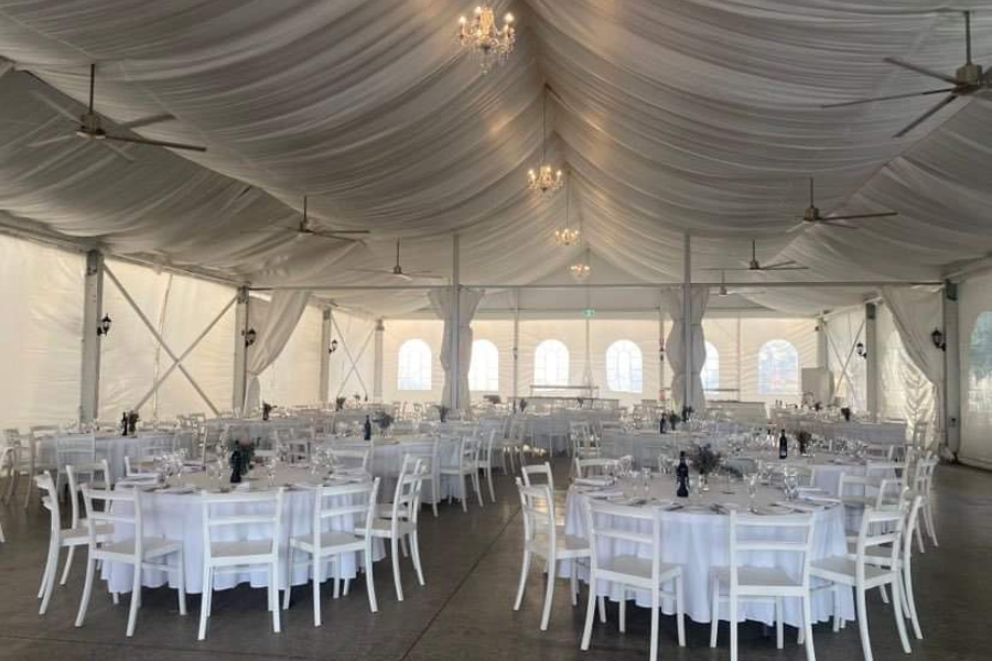 The Marquee dressed with chandeliers and ceiling draping